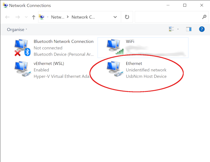 A screenshot of the Network Connections window with the Ethernet unidentified network UsbNcm Host Device highlighted